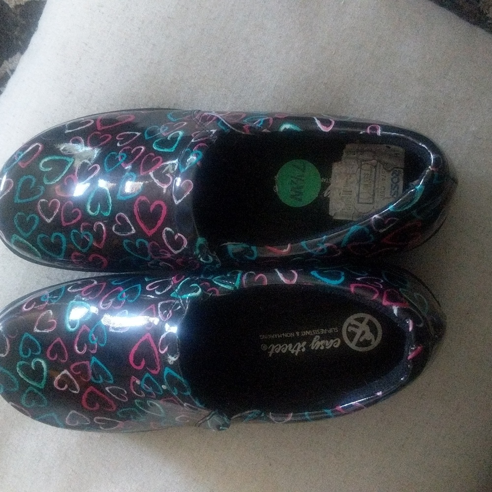 Easy Street nursing shoes size 7 1/2 wide.  They were worn once.